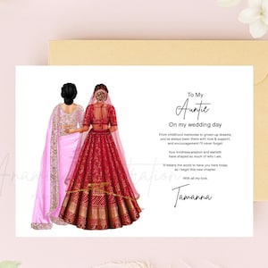 Pode incluir: Um cartão de felicitações com uma ilustração de duas figuras vistas de costas, uma com um sari rosa claro e outra com um lehenga vermelho com bordados dourados. O texto diz: To My Auntie On my wedding day, seguido de uma mensagem e o nome Tamanna.