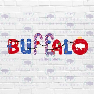 May include: A festive graphic with the word "BUFFALO" spelled out in red and blue letters, decorated with candy cane stripes, string lights, and a Christmas ornament featuring a bison silhouette. The design is set against a white brick wall.
