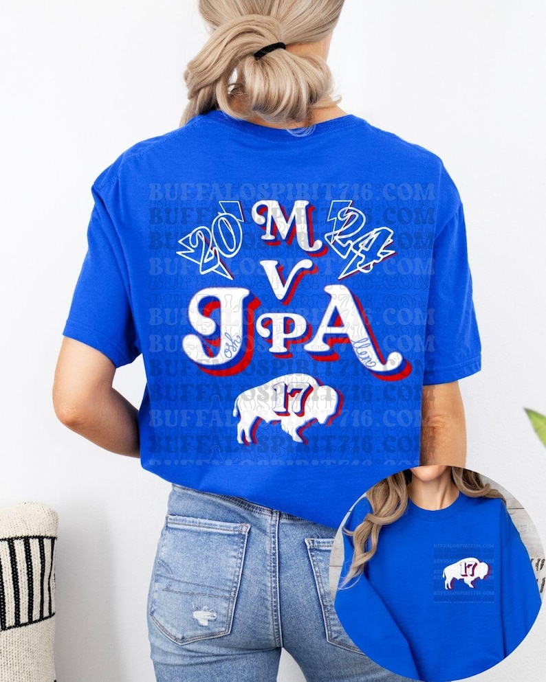May include: A royal blue t-shirt with a white buffalo silhouette and the text "20 M V JPA 24" in red, white, and blue. The text is stylized with a vintage font and lightning bolts.