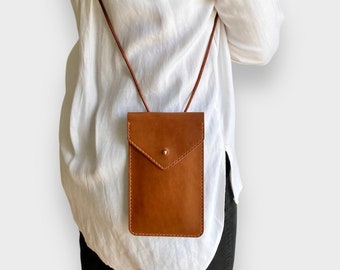 Leather smartphone bag in cognac brown with flap closure and for all smartphones, customizable