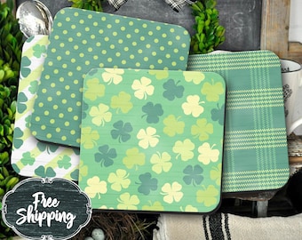 May include: Four green and white coasters with different patterns. The coasters feature shamrocks, polka dots, and plaid designs. The coasters are made of wood and have a rustic look.
