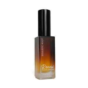 May include: A brown and clear glass bottle of facial serum with a black cap. The bottle has the words "SOULISTIC ROOT" and "Renew FACIAL SERUM" printed on it. The serum is made with Vitamin C and Hyaluronic Acid, and is 1 fl oz / 30ml.