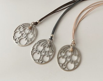 Long chain leather flower pendant