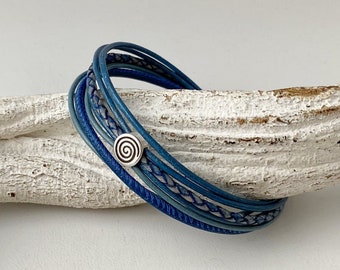 Leather bracelet with a small blue spiral