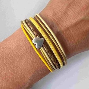 Yellow leather bracelet with a small heart