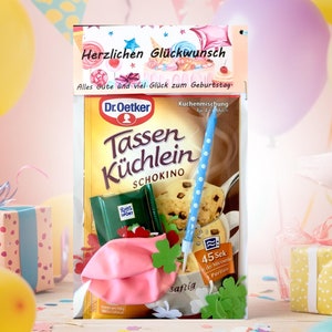 Geburtstagsgeschenktüte, Kuchenmischung verpackt mit Kerze, Konfetti und Luftballon, Geburtstagsüberraschung