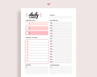 May include: A pink and white daily planner with sections for priorities, other to-dos, a schedule, notes, and tomorrow. The planner has a handwritten title "daily planner" with a pink heart above it.