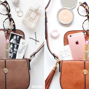 Flat lay product photo featuring a stylish bag surrounded by phone, makeup, printed photos, and glasses, edited with clean and bright Lightroom presets for a professional online shop imagery.