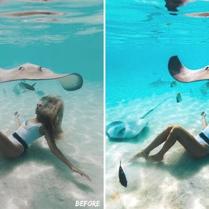 May include: A woman in a white swimsuit swims with stingrays in clear turquoise water. The stingrays are swimming above her, and she is looking up at them. The water is very clear, and the sand is white.
