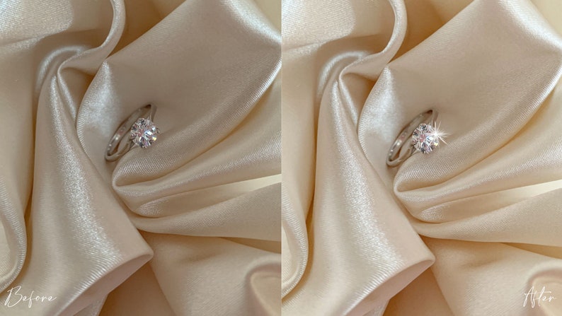 May include: A close-up of a silver ring with a large, clear diamond on a white satin background. The diamond sparkles brightly in the light.
