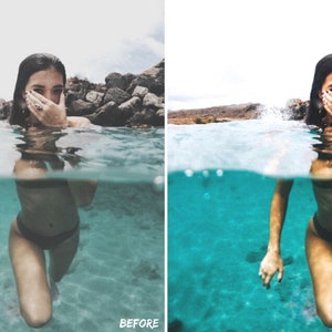 May include: A woman in a black swimsuit is submerged in turquoise water, with her hand covering her mouth. The water is clear and you can see the bottom of the pool. The woman is looking at the camera.