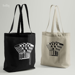 May include: Two tote bags with a black and white graphic of a building. The bag on the left is black and the bag on the right is beige.