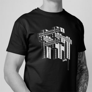 T-shirt graphique en coton biologique représentant le ministère de la Voirie de Tbilissi. Pour l&#39;amateur d&#39;architecture esthétique brutaliste, moderne, minimaliste.