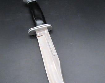 Up for sale is a Vintage New Old Stock Buck 119 V Special Hunting Knife Fixed Blade with Black Handle!!!