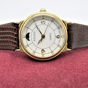 Vintage Axcess Quartz two-tone watch with Roman numerals and a date display. Axcess Women Dress Moon Phase Date Brown Leather Quartz  main image 4