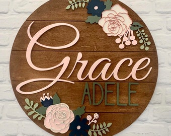 24" round floral shiplap baby name sign for nursery or shower decor featuring beautiful roses and flowers with a custom 3d name