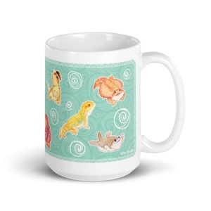 May include: White ceramic mug with a teal background and a pattern of swirling lines. The mug features a repeating design of cartoon bearded dragons in various poses. The text "Fatty Panda" is printed on the bottom right corner of the mug.