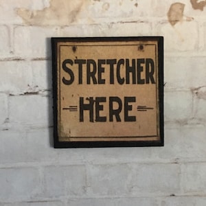On SALE -  - Wood Stretcher Here Sign -This is not life size. Was 4.00.