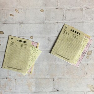 May include: Two yellow and white patient record files with the text "Anjuman Bahtarani Patient Record File" on the front.