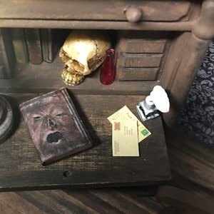 Ratty Old Book - “Faux Leather” Screaming Face Approx 1”  - book does not open - this is not life size.