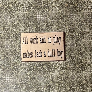 Wood “All Work and No Play Makes Jack a Dull Boy” sign - this is not life size.