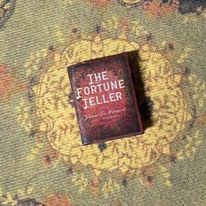 Best Seller -  Old Ratty Book - Fortune Telling by Cards Book 1” (book not made to open)  - this is not life size.
