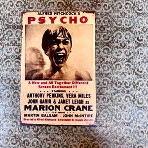 Best Seller - Aged Alfred Hitchcock Psycho Movie Poster Approx 1 3/4” x 1 1/4” - this is not life size.