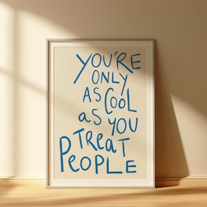 May include: A framed print with a white background and blue text that reads "You're only as cool as you treat people".