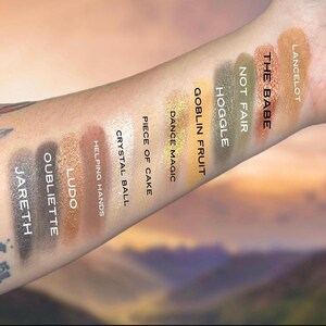 May include: A set of three ceramic mugs with a speckled, matte finish. The mugs are in shades of cream, light gray, and dark gray. Each mug has a simple, minimalist design, perfect for coffee or tea.
