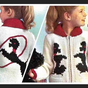 May include: A white knitted cardigan with a red collar and black poodle design. The cardigan has a zip fastening and a pocket on the front. The back of the cardigan features a black poodle with a red collar and a red rope.