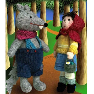 May include: A gray knitted wolf wearing a blue and pink scarf and overalls stands next to a girl wearing a red knitted hooded cape and a yellow knitted sweater. The girl is holding a green basket with a white flower.