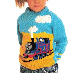 May include: A blue knitted sweater with a yellow, red, and blue Thomas the Tank Engine design. The sweater has a white cloud design on the blue portion of the sweater.