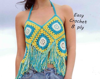 May include: A crocheted halter top with a yellow, white and blue geometric pattern and fringe trim. The text "Easy Crochet 8 ply" is visible in the image.