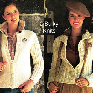 May include: Two white knit cardigans with button closures. The cardigan on the left has a ribbed texture and the cardigan on the right has a cable knit pattern. Both cardigans have a collar and long sleeves.