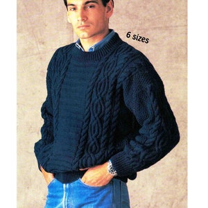 May include: A dark blue knitted jumper with a cable knit pattern. The jumper has a crew neck and long sleeves. 6 sizes.