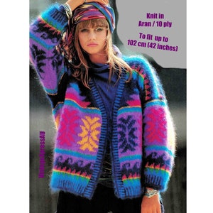 May include: A colourful, fuzzy cardigan with a geometric pattern in shades of purple, blue, pink, yellow, and black. Knit in Aran/10 ply yarn, it fits up to 102 cm.