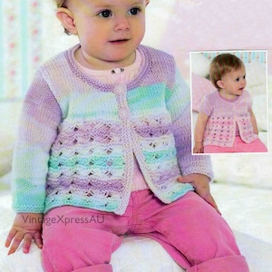 May include: A knitted baby cardigan with a striped pattern in shades of purple, green, and white. The cardigan has a button closure and a delicate lace pattern on the front.