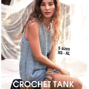 May include: A light blue crochet tank top with a textured design. The image shows the tank top with the text "CROCHET TANK" and "5 sizes XS - XL". The tank top is sleeveless and has a round neckline.
