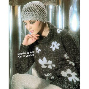 May include: A woman wearing a silver crocheted cap and a black sweater with white floral designs. The sweater has long sleeves and a high collar. The text "Sweater to Knit Cap to Crochet" is visible.