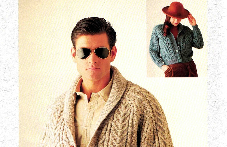 May include: Two people wearing knitted cardigans. The person on the left is wearing a beige cardigan with a cable knit pattern. The person on the right is wearing a teal blue cardigan with a cable knit pattern.