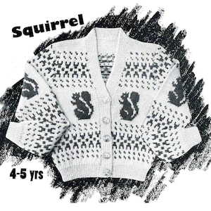 May include: White knitted cardigan with a black squirrel pattern and buttons. The cardigan is for ages 4-5 years old. "Squirrel" is written in bold black letters at the top of the image.