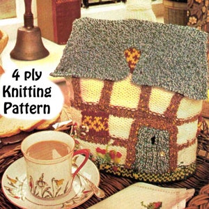 May include: Knitting pattern for a cozy cottage-shaped tea cozy. The cozy is made with different colored yarn and features a door, windows, and a roof. The pattern is for 4 ply yarn.
