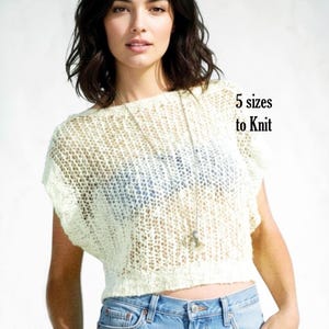 May include: A cream-colored, short-sleeved, loose-knit sweater with a wide neckline and a cropped hemline. The text "5 sizes to Knit" is printed in black on the right side of the image. The sweater features a visible open-weave texture.
