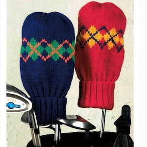 May include: Two knitted golf club head covers. One is navy blue with a green, orange, and white argyle pattern. The other is red with a yellow, navy, and orange argyle pattern. The covers are designed to protect golf clubs.