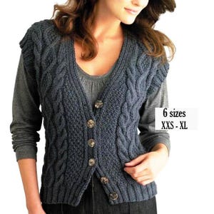 May include: A dark grey sleeveless cable-knit vest featuring a V-neckline, a button-down front with five buttons, and a textured pattern. The garment is available in 6 sizes, ranging from XXS to XL, as indicated by the text on the right side.