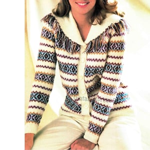 May include: A white cardigan with a colorful striped pattern and a fringed collar. The cardigan has a button closure.