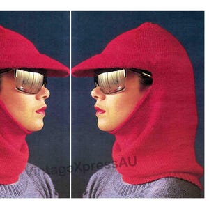 May include: A red knit hat with a visor and a neck covering. The hat is worn by a person wearing sunglasses.