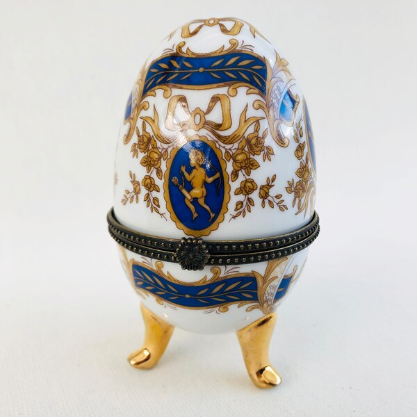 Porcelain egg three-legged jewelry egg bow putte hinged lid blue gold KLH