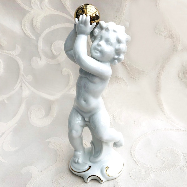 Porcelain figurine putto with gold ball Fraureuth Wallendorf Putto