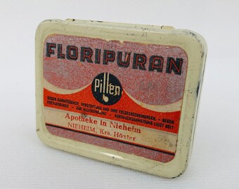 Old medicine pharmaceutical drug tin can Floripuran pills